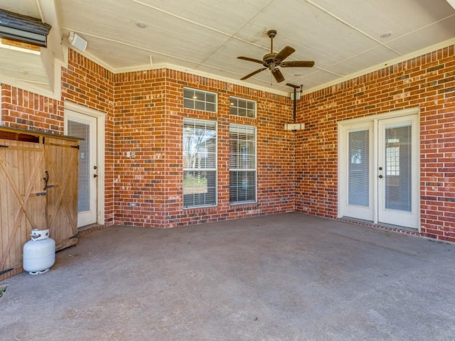 view of patio / terrace with ceiling fan and french doors