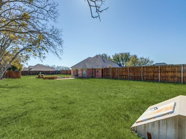 view of yard featuring a fenced backyard