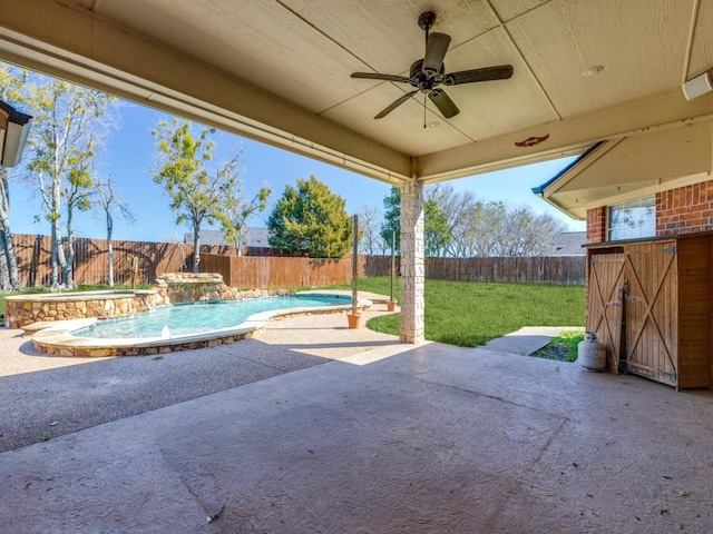 view of patio with ceiling fan, a fenced backyard, and a fenced in pool