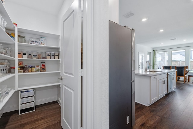 storage area featuring visible vents and a sink