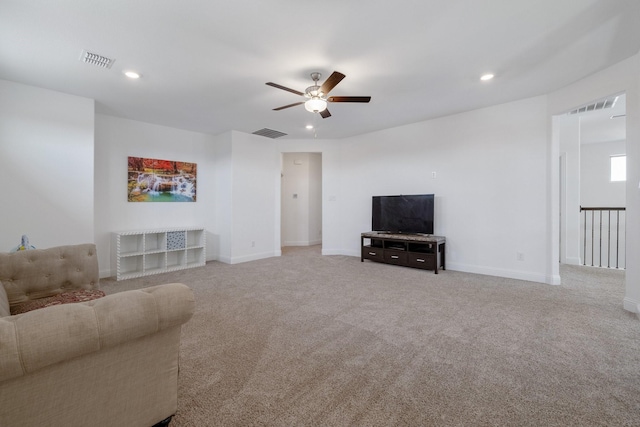 carpeted living area featuring a ceiling fan, recessed lighting, visible vents, and baseboards