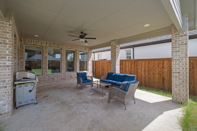 view of patio with ceiling fan, grilling area, an outdoor hangout area, and fence