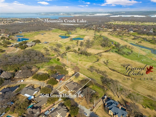 bird's eye view featuring a water view and a residential view