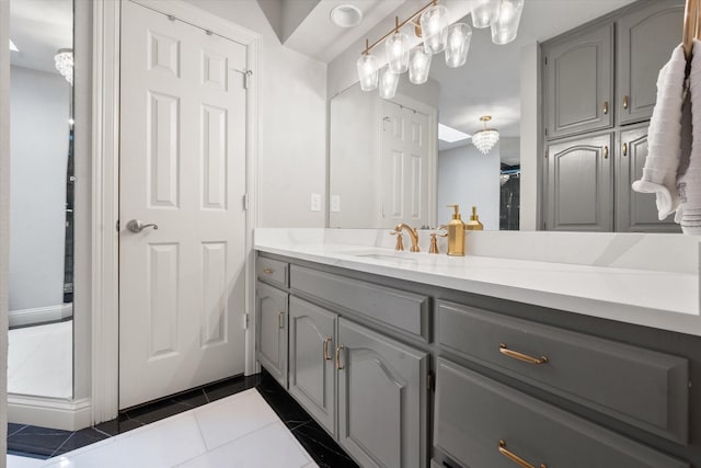 bathroom with tile patterned flooring and vanity