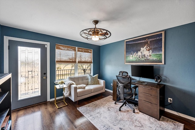 office space with ceiling fan, dark wood-type flooring, and baseboards