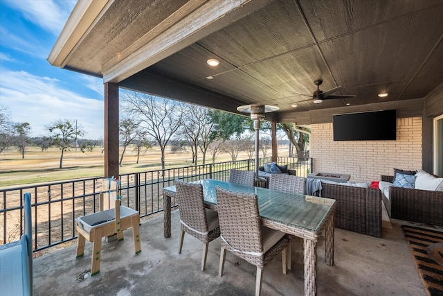 view of patio / terrace featuring an outdoor hangout area, ceiling fan, and outdoor dining space