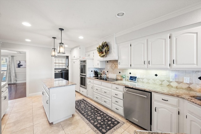 kitchen featuring light tile patterned floors, light stone counters, ornamental molding, appliances with stainless steel finishes, and tasteful backsplash