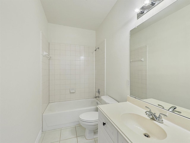 full bathroom featuring toilet, vanity, baseboards, tile patterned floors, and washtub / shower combination