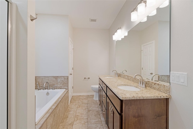 full bathroom featuring a garden tub, a sink, toilet, and double vanity