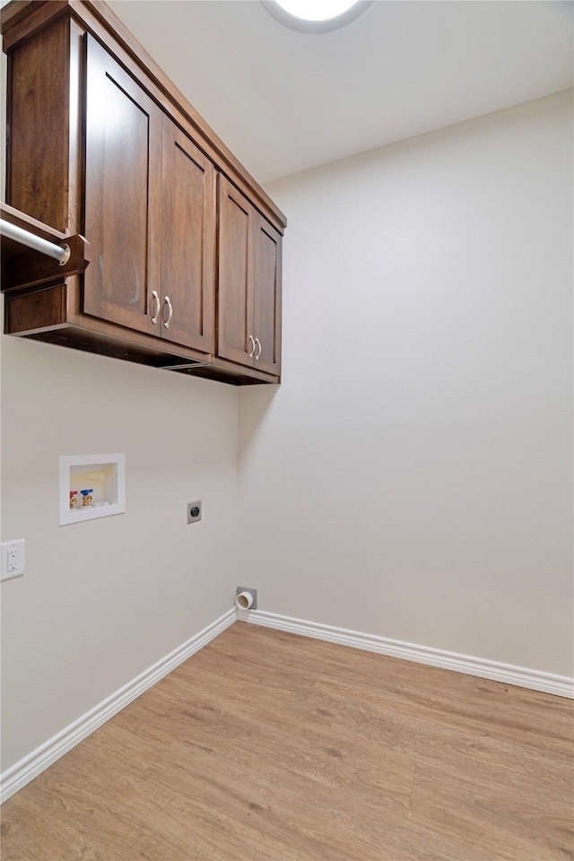 laundry room with washer hookup, cabinet space, light wood-style flooring, hookup for an electric dryer, and baseboards