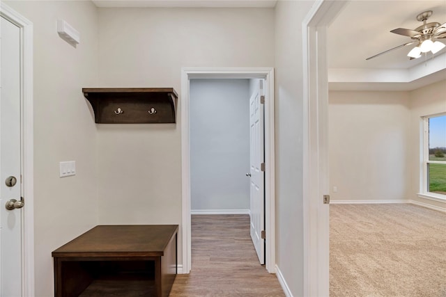 interior space featuring carpet and baseboards