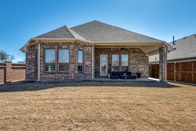 back of house featuring a patio area, roof with shingles, fence, and a yard