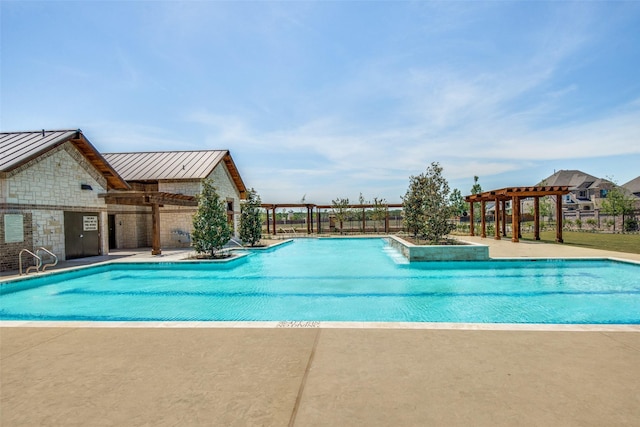 community pool with a patio area, fence, and a pergola