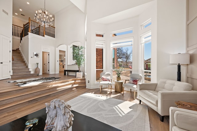 1503 Kingswood Ln, Colleyville, TX 76034 - living room featuring a high ceiling, stairs, wood finished floors, a chandelier, and recessed lighting