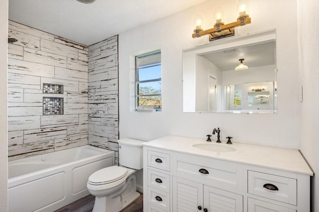 full bath with shower / bath combination, vanity, and toilet