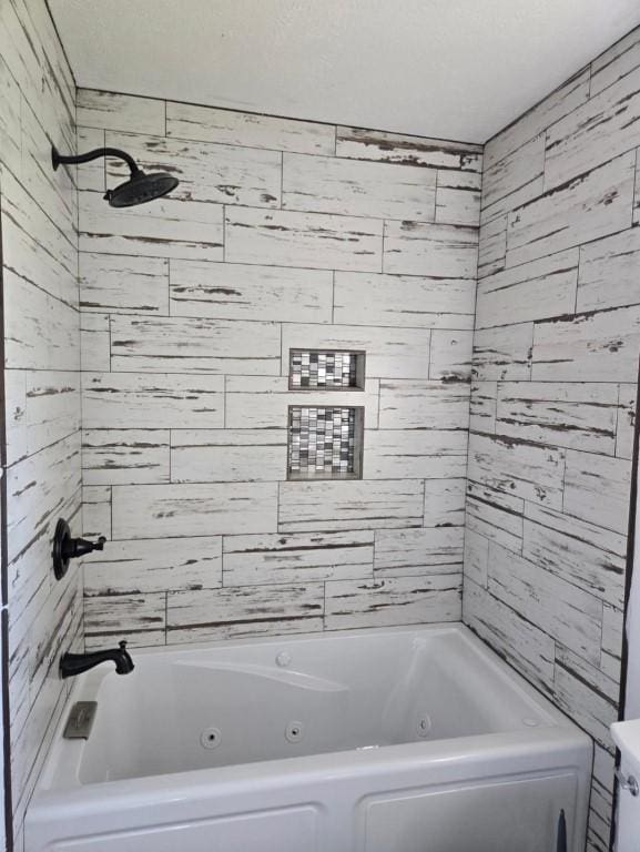 bathroom with a combined bath / shower with jetted tub