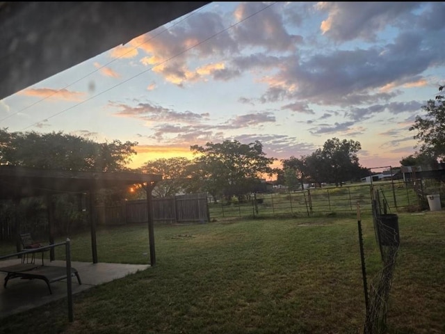view of yard featuring a patio area and fence