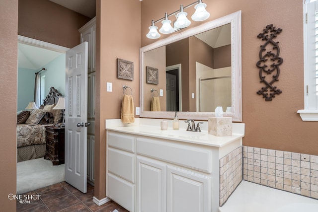 bathroom with a stall shower, tile patterned flooring, vanity, and a bath