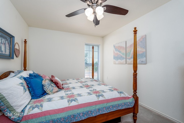 carpeted bedroom featuring ceiling fan and baseboards