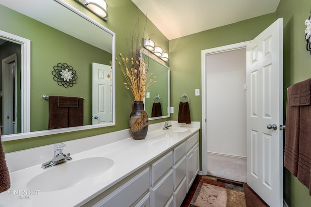 bathroom featuring double vanity and a sink