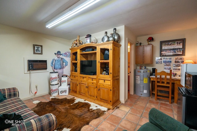 living room with light tile patterned floors, water heater, and a wall mounted AC