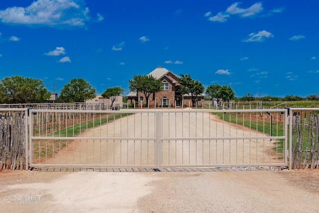 view of gate with fence