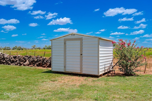 view of shed with fence