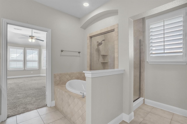 full bath featuring baseboards, tiled shower, ceiling fan, tile patterned floors, and a garden tub