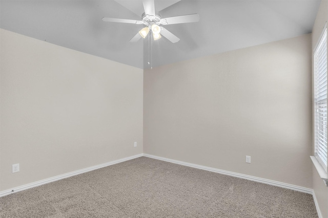 unfurnished room with carpet, a ceiling fan, and baseboards