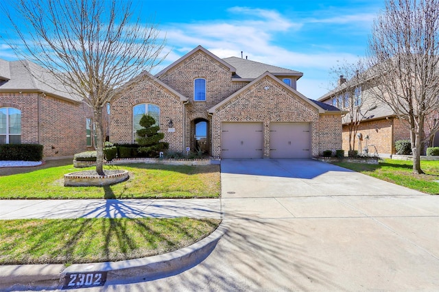 view of front of home featuring a garage, driveway, a shingled roof, a front lawn, and brick siding