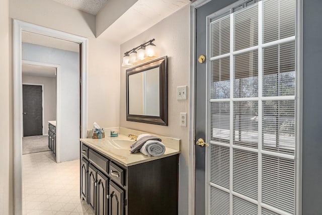 bathroom with vanity and tile patterned floors