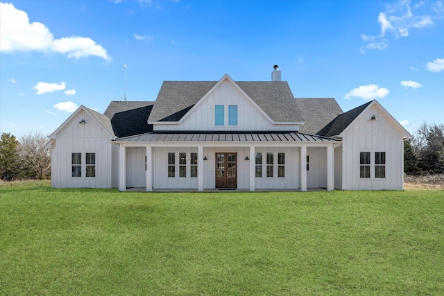 view of front of house with a standing seam roof, french doors, board and batten siding, and metal roof