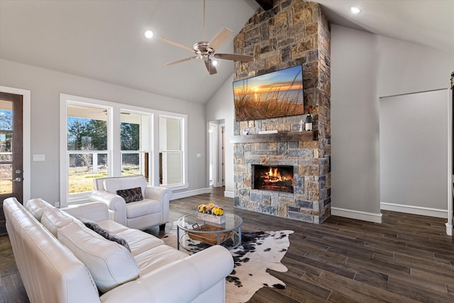 living room featuring ceiling fan, high vaulted ceiling, wood finished floors, and a fireplace