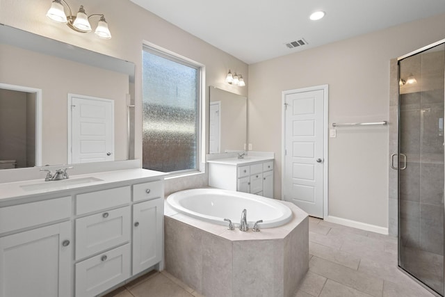 bathroom with visible vents, a stall shower, a sink, a bath, and tile patterned floors