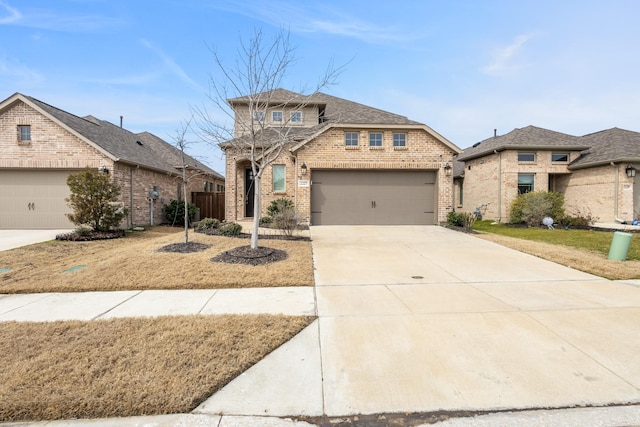 view of front of home featuring brick siding, driveway, and fence