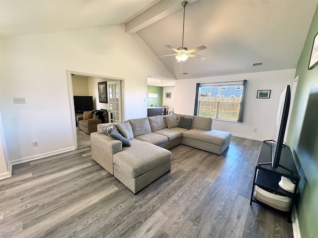 living room with visible vents, wood finished floors, high vaulted ceiling, beamed ceiling, and baseboards