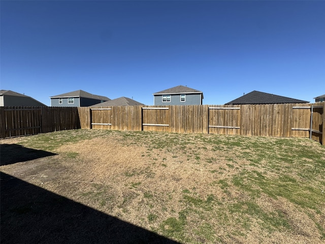 view of yard featuring a fenced backyard