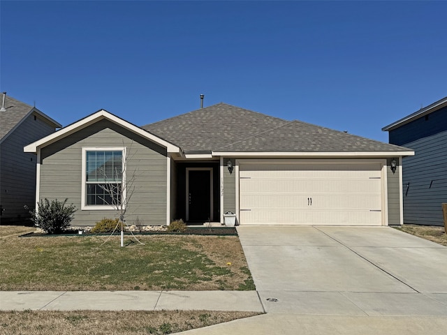 single story home featuring concrete driveway, a shingled roof, a front lawn, and an attached garage