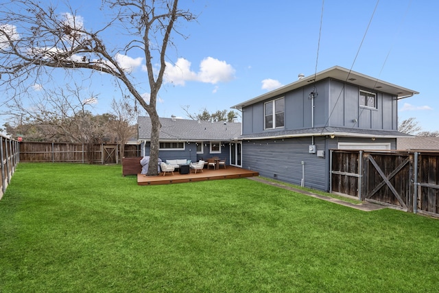 10125 Lanshire Dr, Dallas, TX 75238 - back of property with a gate, a deck, board and batten siding, a fenced backyard, and a lawn