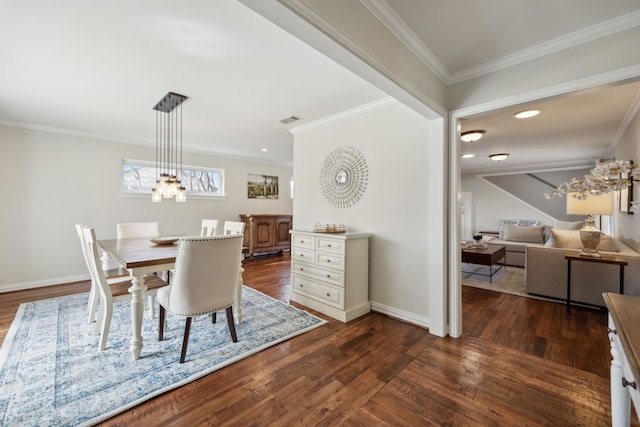 dining area with dark wood-style flooring, visible vents, crown molding, and baseboards