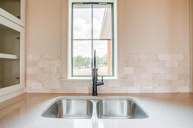 kitchen with light countertops and a sink