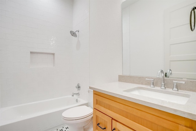 bathroom featuring toilet, vanity, and bathing tub / shower combination