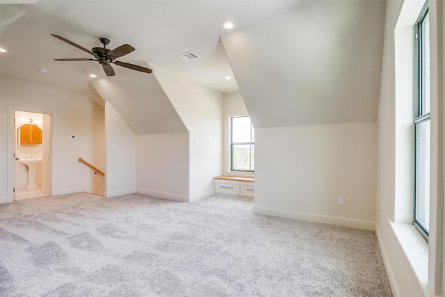 bonus room featuring light carpet, baseboards, visible vents, vaulted ceiling, and recessed lighting