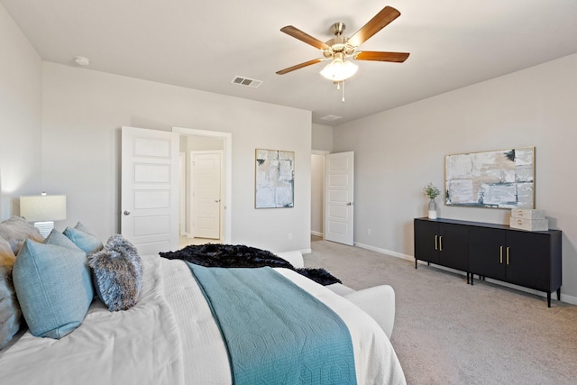 carpeted bedroom featuring baseboards, visible vents, and a ceiling fan