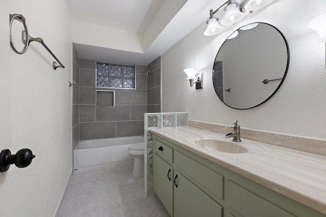 bathroom featuring baseboards, shower / tub combination, vanity, and toilet