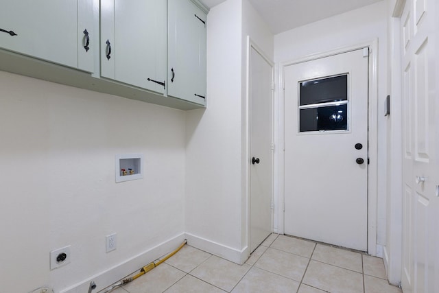 laundry room with washer hookup, light tile patterned floors, cabinet space, hookup for an electric dryer, and baseboards