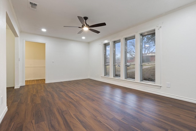 empty room with recessed lighting, a ceiling fan, visible vents, baseboards, and dark wood-style floors