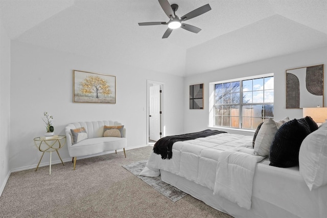 carpeted bedroom with ceiling fan, baseboards, and vaulted ceiling