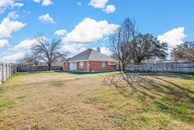 view of yard with a fenced backyard