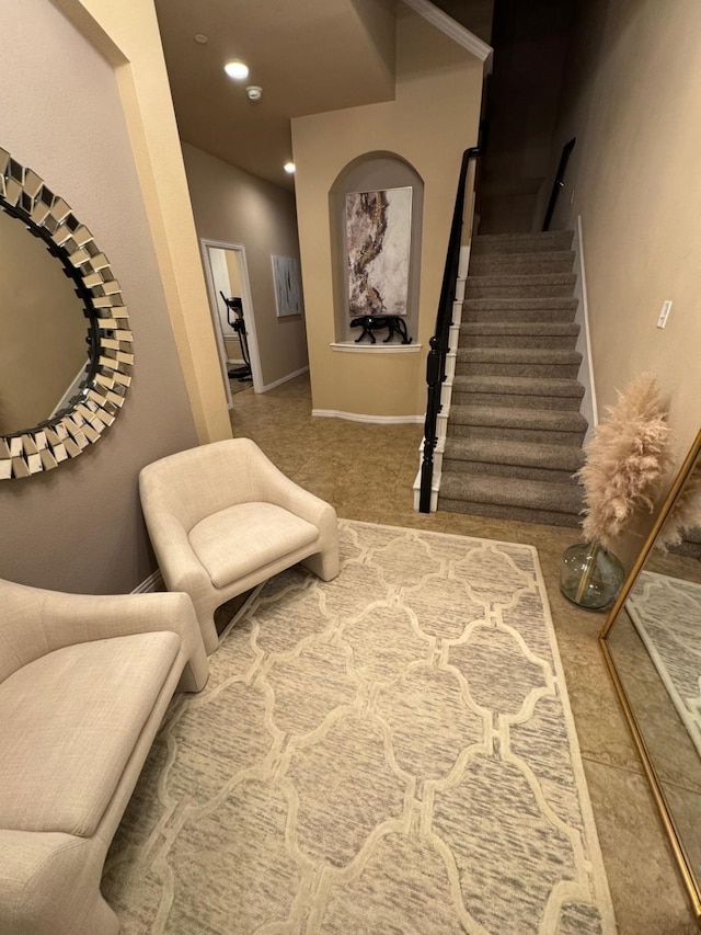 living area featuring carpet floors, baseboards, stairway, and recessed lighting